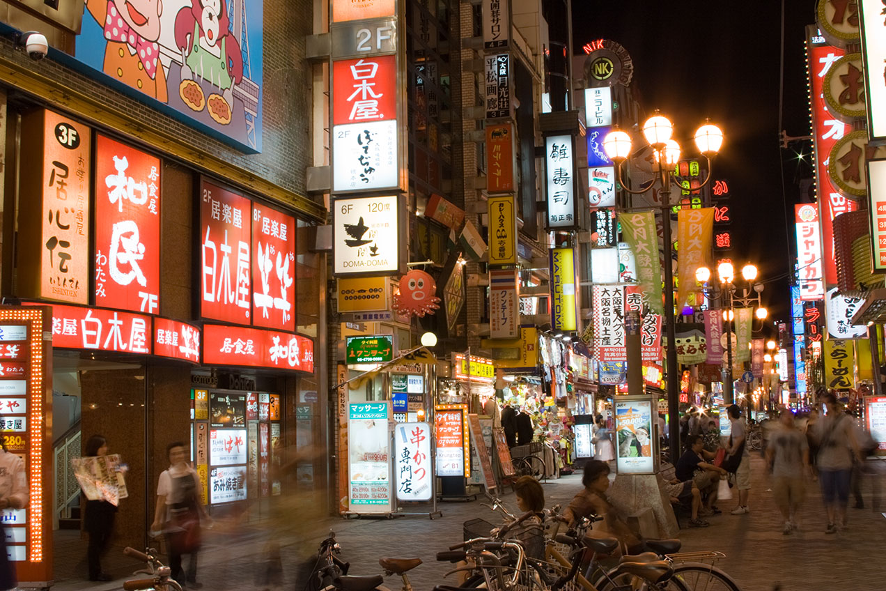 Street covered in Neon Billboards in Osaka at Night