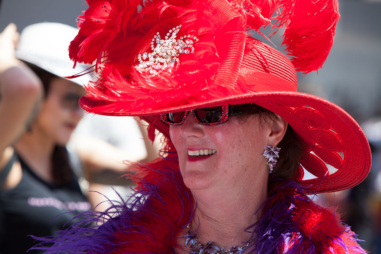 San Francisco Pride Parade Portrait - woman with giant red hat